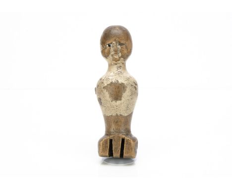 An early English wooden doll's torso,  with one inset enamel eye, remains of paint finish, nails where arms were attached and