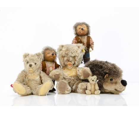 Post-war Steiff toys, a miniature teddy bear with blonde mohair, black eyes, brown stitched nose and mouth, swivel head and j