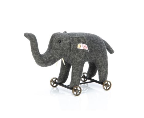A Steiff limited Club Edition 2004 Felt Elephant on Wheels,  2707 for the year, 12cm., in original box with certificate