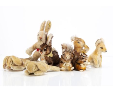 Post-war Steiff rabbits and squirrels, a Posy squirrel --6½in. (16.5cm.) high; an Ossi rabbit; two Perri squirrels, two Flopp