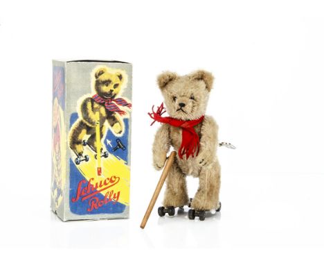 A Schuco clockwork Rolly teddy bear 1930s,  with beige mohair, clear and black glass eyes with  brown backs, black stitched n