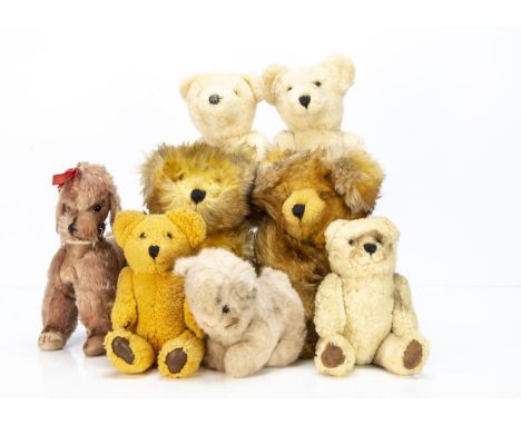 Six sheepskin jointed teddy bears, possibly Nordic, the largest --15½in. (39.5cm.) high; a post-war Steiff light brown dralon