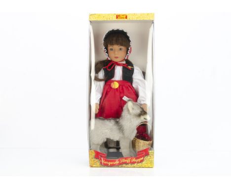 A Steiff limited edition Little Red Riding Hood doll with wolf,  with vinyl head, stuffed body, original clothes and mohair w