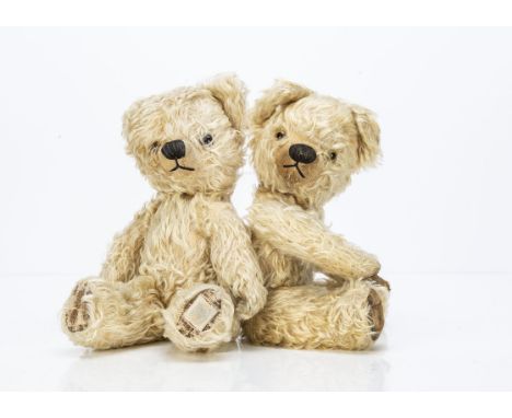 A near identical pair of post-war Chad Valley teddy bears,  with light golden mohair, one with orange and black and one with 