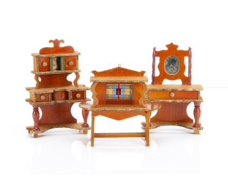 Four pieces of German reddish stained dolls' house furniture,  with Dresden paper trim, comprising a dressing table --6in. (1