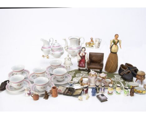 A Continental doll's tea set, with six cups and saucers, teapot, sugar and milk --5¼in. (13.5cm.) height of teapot (cup chipp