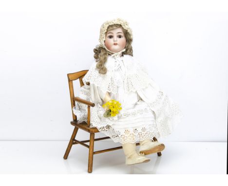 A large Simon &amp; Halbig for Kämmer &amp; Reinhardt child doll,  with brown lashed sleeping eyes, pierced ears, blonde moha