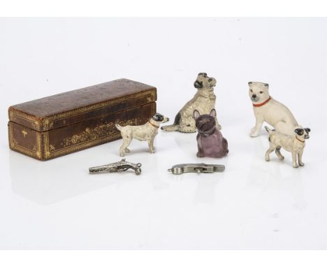 Miniature dogs, an amethyst glass bulldog --1½in. (4cm.) high; a bisque pug; two German lead terriers; and another; a leather