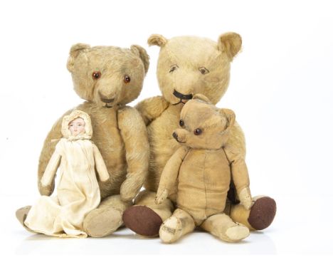 Three Merrythought teddy bears,  a 1930s bear with golden mohair, orange and black glass eyes, pronounced muzzle, black stitc