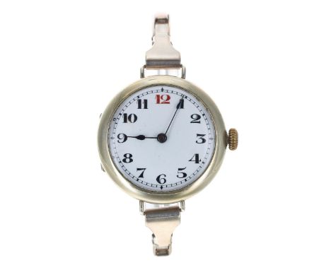 Swiss 8 days nickel cased wire-lug wristwatch, enamel dial with Arabic numerals, red twelve and minute track, blued steel han