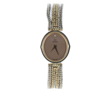 Omega 18ct bi-colour oval lady's wristwatch, reference no. 1387, oval champagne striped dial with single diamond at the twelv
