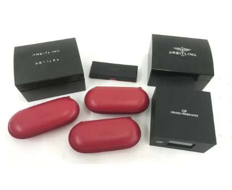 Three Omega service pouches; together with a Breitling watch box, Breitling for Bentley watch box, Smiths watch box and a Gir