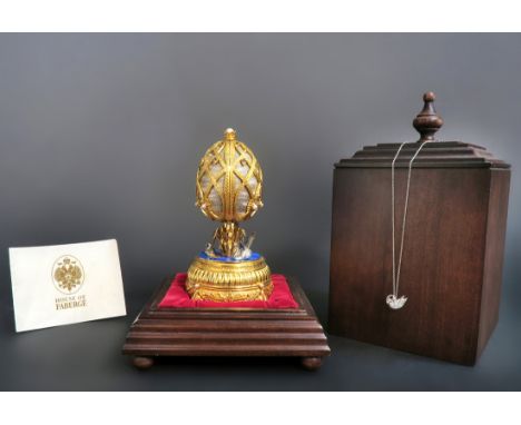 franklin Mint's "FABERGE SWAN LAKE IMPERIAL JEWELED MUSICAL" Egg 24K Gold Plated & Sterling Silver. An entrancing artistic ma