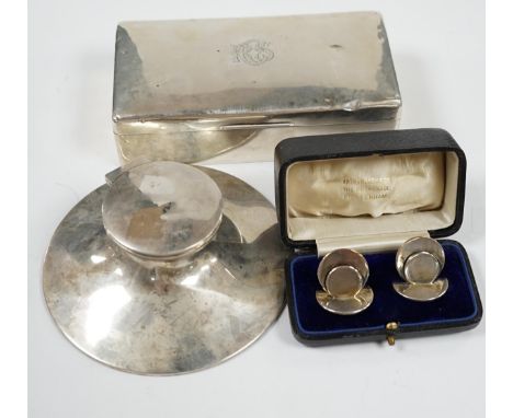 A silver mounted capstan inkwell, Birmingham, 1914, a silver mounted cigarette box and a cased pair of silver menu holders. C