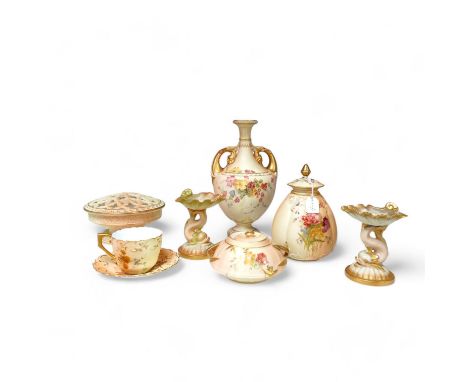Royal Worcester blush ivory ornamental items: including a vase, two pots and covers, two dolphin stands, a cup and saucer and