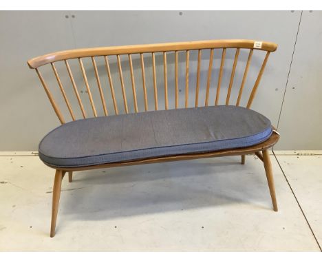 An Ercol elm and beech comb back bench with squab cushion seat, width 112cm, depth 44cm, height 78cm. Condition - fair