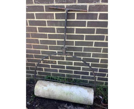 A wrought iron and reconstituted stone garden roller, height 116cm. Condition - fair