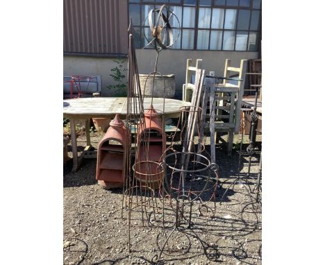 Three wrought iron garden growing frames, a sundial and a pot stand, largest height 164cm. Condition - fair