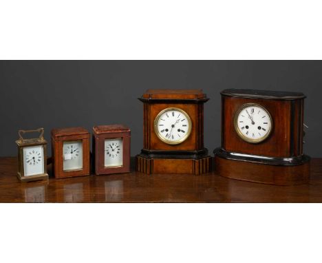 A group of clocks and timepieces to include a fusee dial clock, 34cm diameter; three carriage timepieces; two mantle clocks a