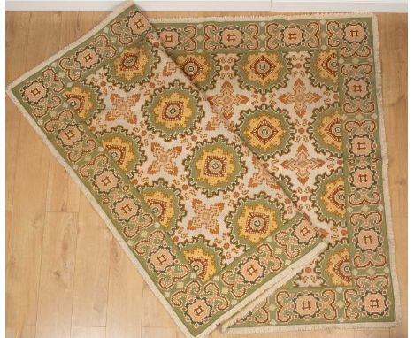 An Asian red ground rug with floral and foliate scrolling decoration within a banded blue and white floral border, 78cm x 123
