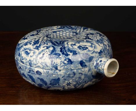 An unusual 19th century blue and white pottery flask 15cm diameterCondition report: A crack and some minor restoration to the