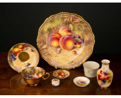 A collection of 1930s Royal Worcester Fallen Fruits ceramics,
hand painted to include a cup and saucer signed Freeman, a plat