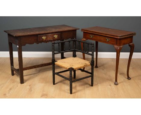 A 19th century mahogany fold over tea table with cabriole legs, 77cm wide x 38cm deep x 73cm high together with an ebonised b