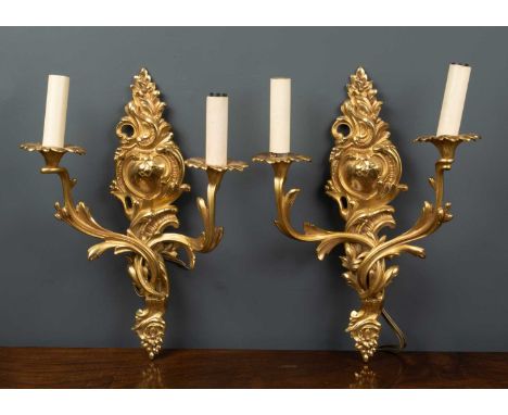 A pair of 20th century gilt metal twin branch wall lights of acanthus scroll design, each 31cm wide x 43cm highCondition repo