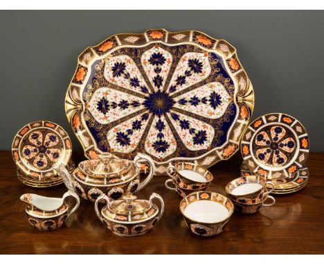 A Royal Crown Derby imari pattern teaset
to include a teapot, sugar bowl, milk jug, four teacups and saucers, four side plate