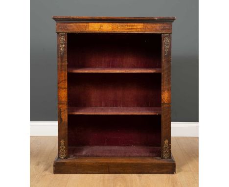 A 19th century walnut bookcase with satinwood inlaid decoration and gilded mounts, raised on a plinth base with one adjustabl