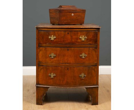 A 19th century mahogany tea caddy of sarcophagus form, 32.5cm wide x 17cm deep x 19cm high together with a small sized walnut