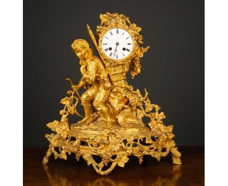 A late 19th century French gilt metal figural mantle clock depicting a grape harvester and mounted with fruiting vines, the e