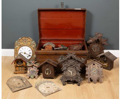 A collection of approximately eighteen novelty cuckoo and other clocks together with a French wall clock with enamelled dial 