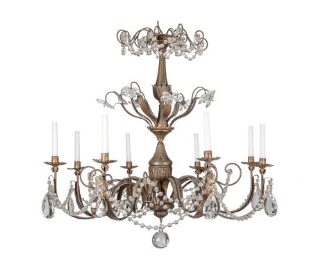 
	
		A patinated and glass eight light chandelier, 20th century, with stiff leaves, cut glass Maison Bagues style flowerheads