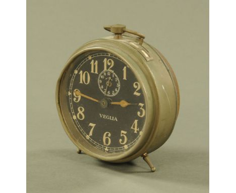 A vintage metal cased Veglia alarm clock with black dial and Arabic numerals, diameter 13 cm (ref 936) 