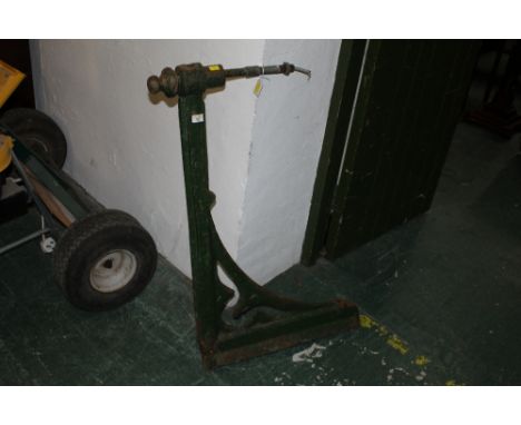 A green painted metal bracket 