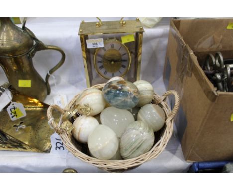 Basket of alabaster eggs and mantle clock