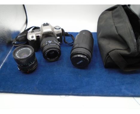 Minolta maxxum camera with bag and few accessories and a sigma lens from house clearance