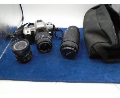 Minolta maxxum camera with bag and few accessories and a sigma lens from house clearance