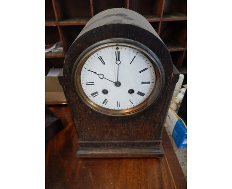 Oak Cased Mantle Clock with enamelled dial with pendulum 12 1/2 inches tall