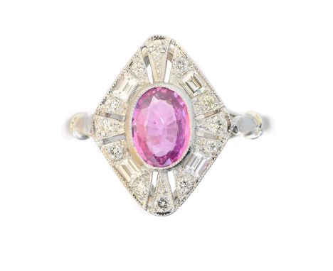 A sapphire and diamond cluster ring, A sapphire and diamond cluster ring, the oval shape pink sapphire within a baguette and 