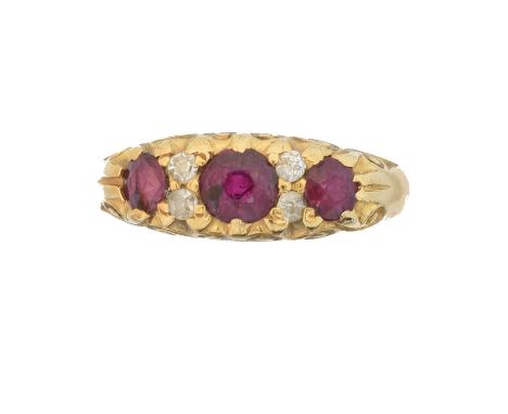 A Victorian 18ct gold ruby and diamond dress ring,  A Victorian 18ct gold ruby and diamond dress ring, the circular shape rub