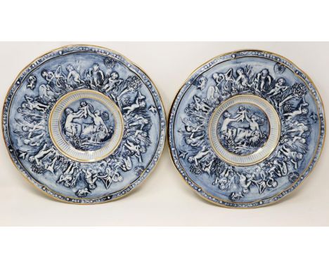 Two large Capodimonte gilt blue and white cabinet plates with relief figural decoration, no cracks or chips, D: 31 cm. UK P&a