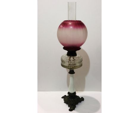 Oil lamp with pink glass shade and glass reservoir, overall H: 70 cm. Not available for in-house P&amp;P 
