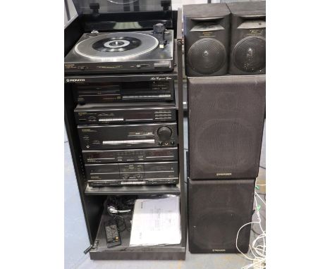 Pioneer stacking stereo system in a glass cabinet with four Pioneer speakers, cabinet 46 x 42 x 98 cm H. All electrical items