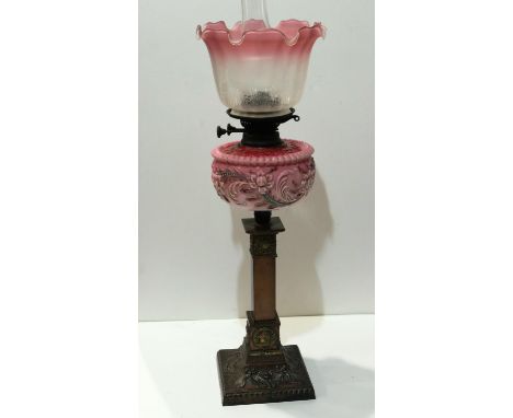 Oil lamp with pink glass shade and reservoir on a square brass base, overall H: 70 cm. Not available for in-house P&amp;P 