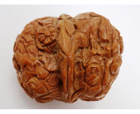 Japanese carved nut, decorated with multiple figures vines and bamboo, H: 35 mm. UK P&amp;P Group 1 (£16+VAT for the first lo