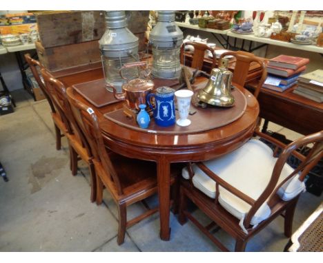 Good quality Asian Hardwood dining table with 2 leaves and a set of 8 Chairs with removable upholstered seats