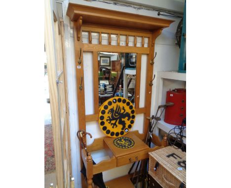 20thC Light Oak Hallstand with mirror back, brass hooks and turned detail