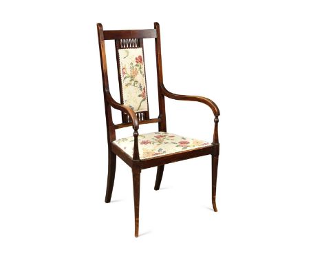 George Walton (1867-1933), a stained mahogany armchair, circa 1900,  the back with upholstered panel and spindle panels above